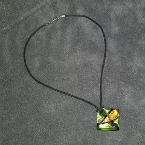 Short dichroic glass pendant on black cord